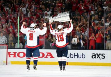 Washington, DC, USA. 3rd Oct, 2018. Washington Capitals left wing Alex  Ovechkin (8) raises the Stanley Cup as he takes the ice during the Stanley  Cup banner raising ceremony prior to the