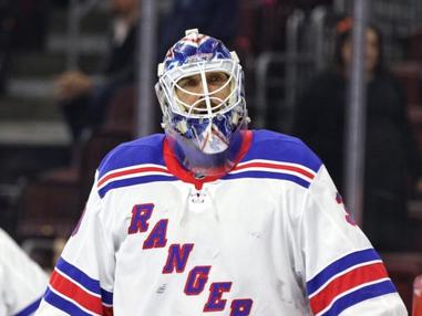 Kevin Weekes makes his New York Rangers debut at Madison Square Garden on  Oct. 6, 2005 as the first African American goalie to start for the team.  Weekes is shown defending the