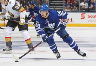 Michael Peca of the Toronto Maple Leafs skates against the Detroit News  Photo - Getty Images