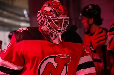 New Jersey Devils goaltender Nico Daws (50) celebrates with left wing Jimmy  Vesey (16) after the Devils defeated the Vancouver Canucks 7-2 in an NHL  hockey game Monday, Feb. 28, 2022, in