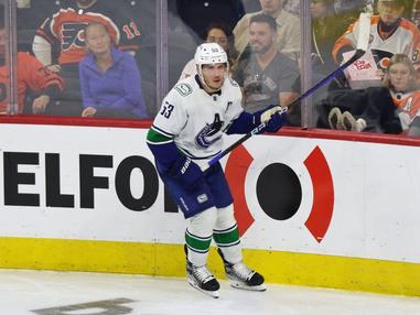 The Vancouver Canucks Flying Skate jersey of Bo Horvat hangs in its